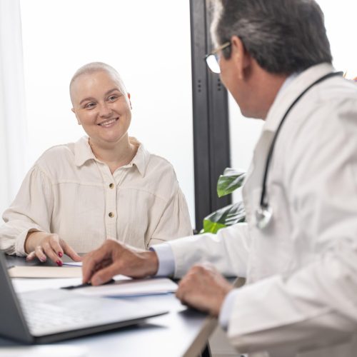woman-suffering-breast-cancer-talking-with-her-doctor